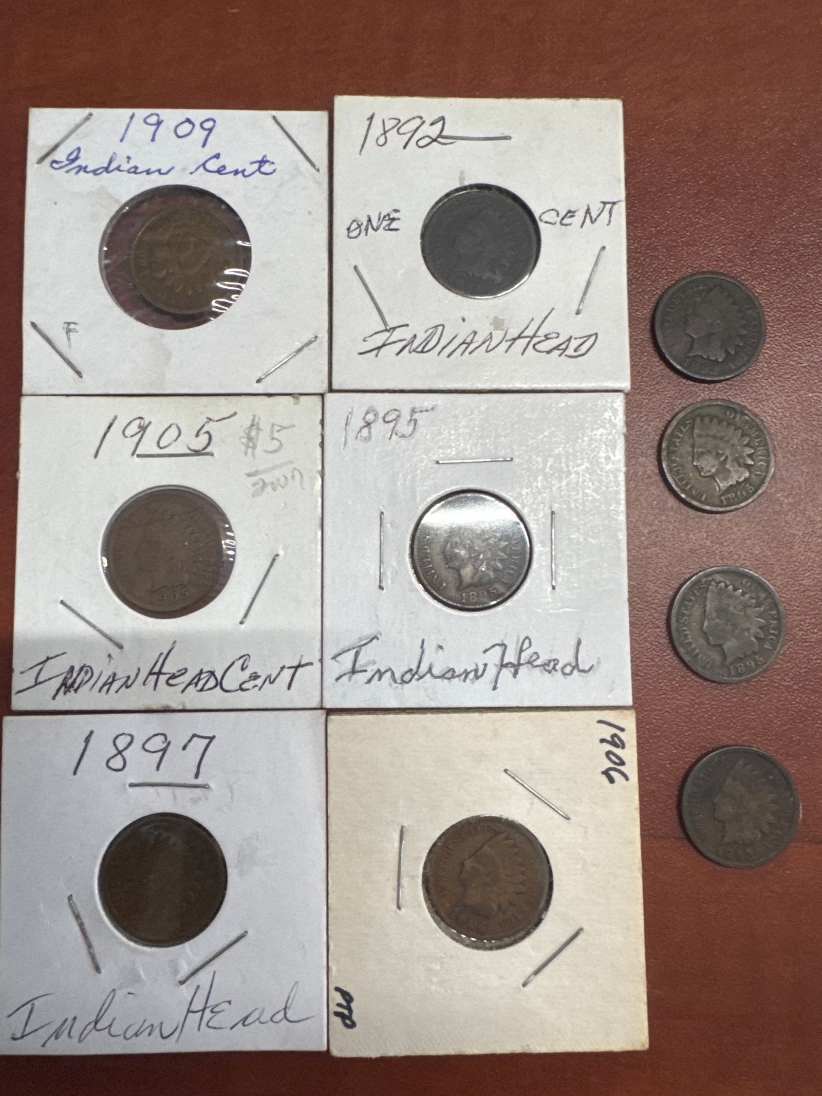 Collection of Six Indian Head Cents: A collection of six Indian Head cents, dated from 1892 to 1909. Each coin is housed in a protective sleeve.