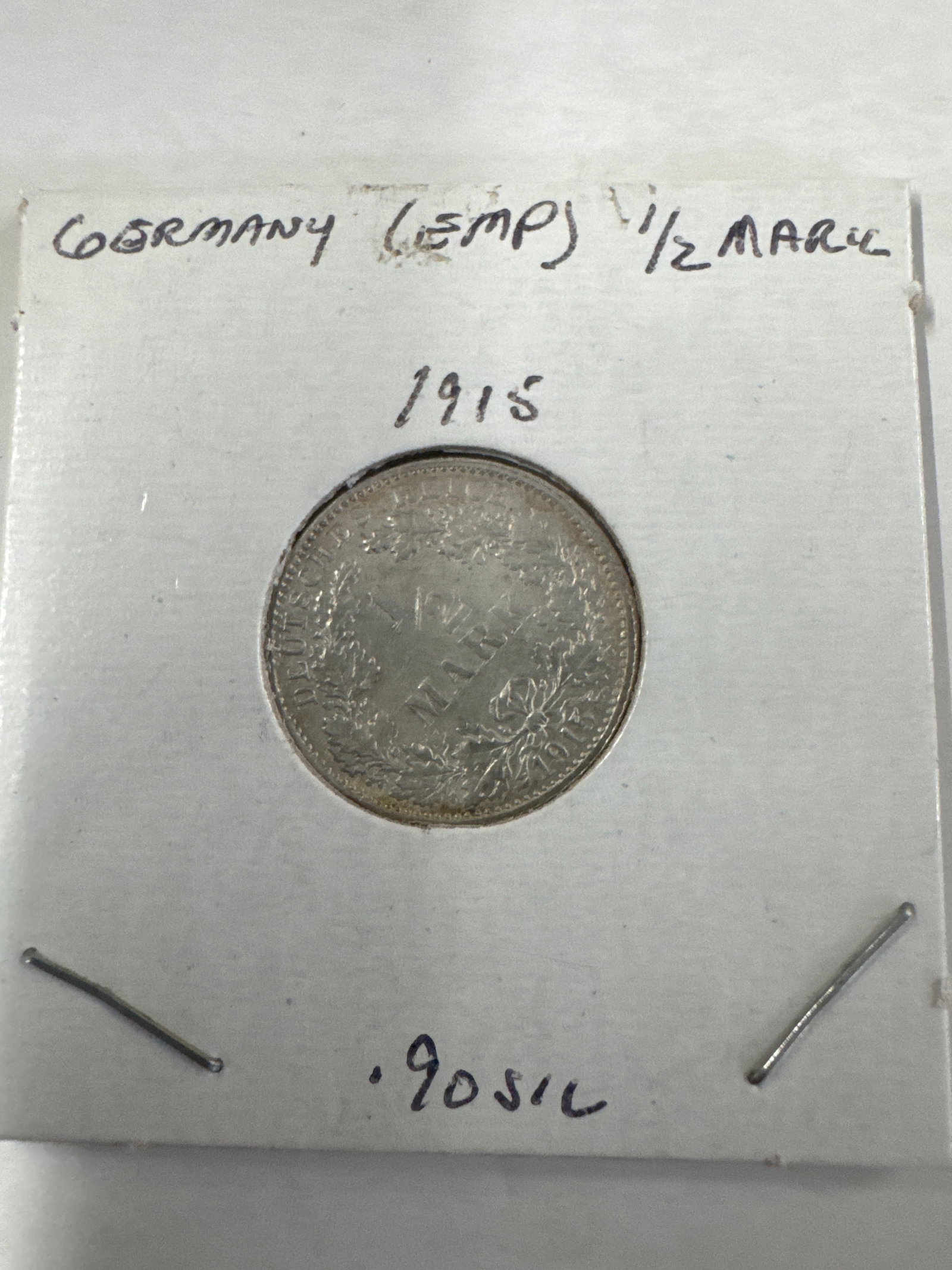 1915 Germany (EMP) 1/2 Mark Coin: A 1915 German 1/2 Mark coin, identified as 'Germany (EMP) 1/2 Mark'. 