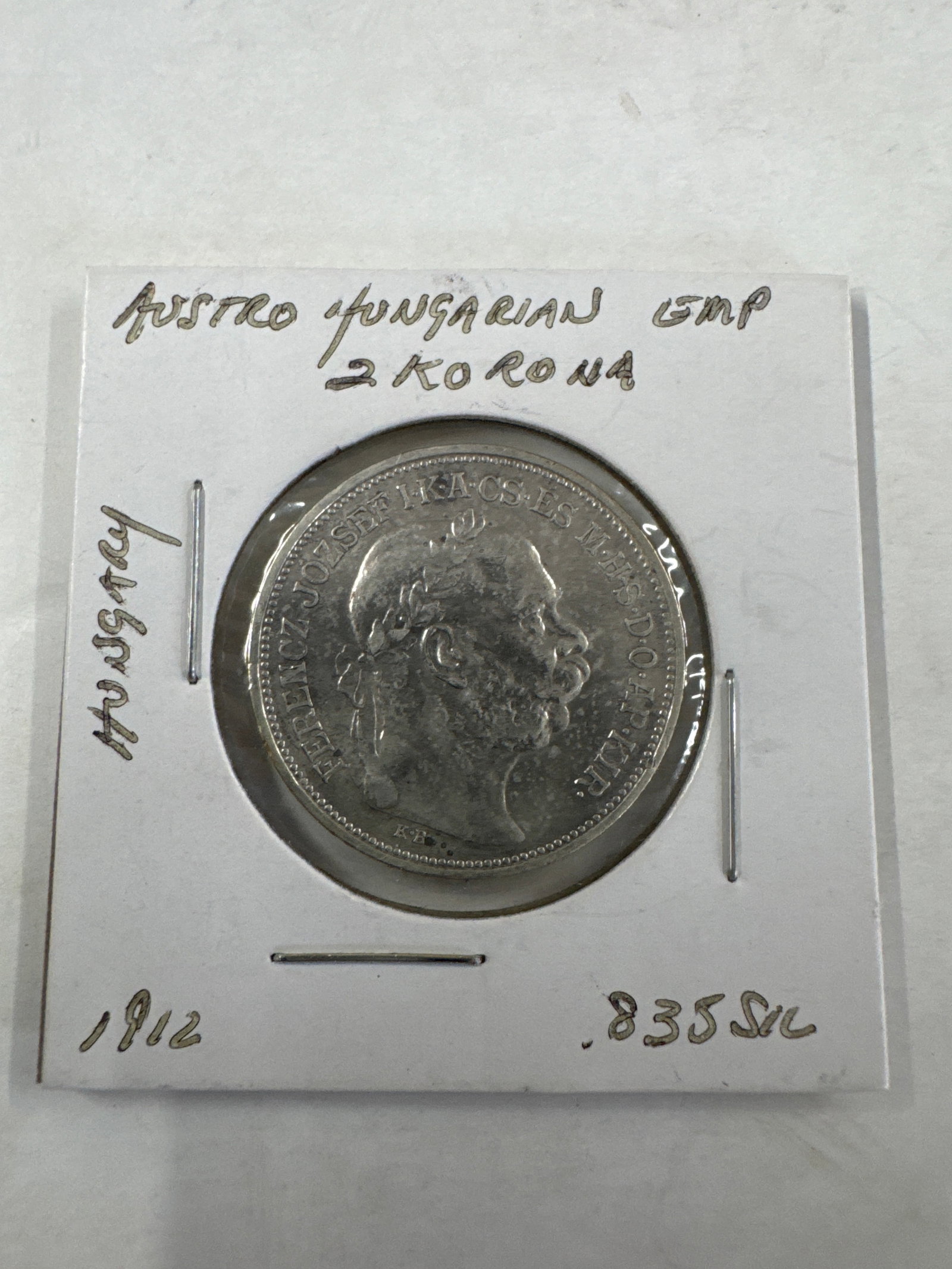 1912 Austro-Hungarian 2 Korona Silver Coin: A single 1912 Austro-Hungarian 2 Korona silver coin. The coin features a profile of Emperor Franz Joseph I. Silver .835.