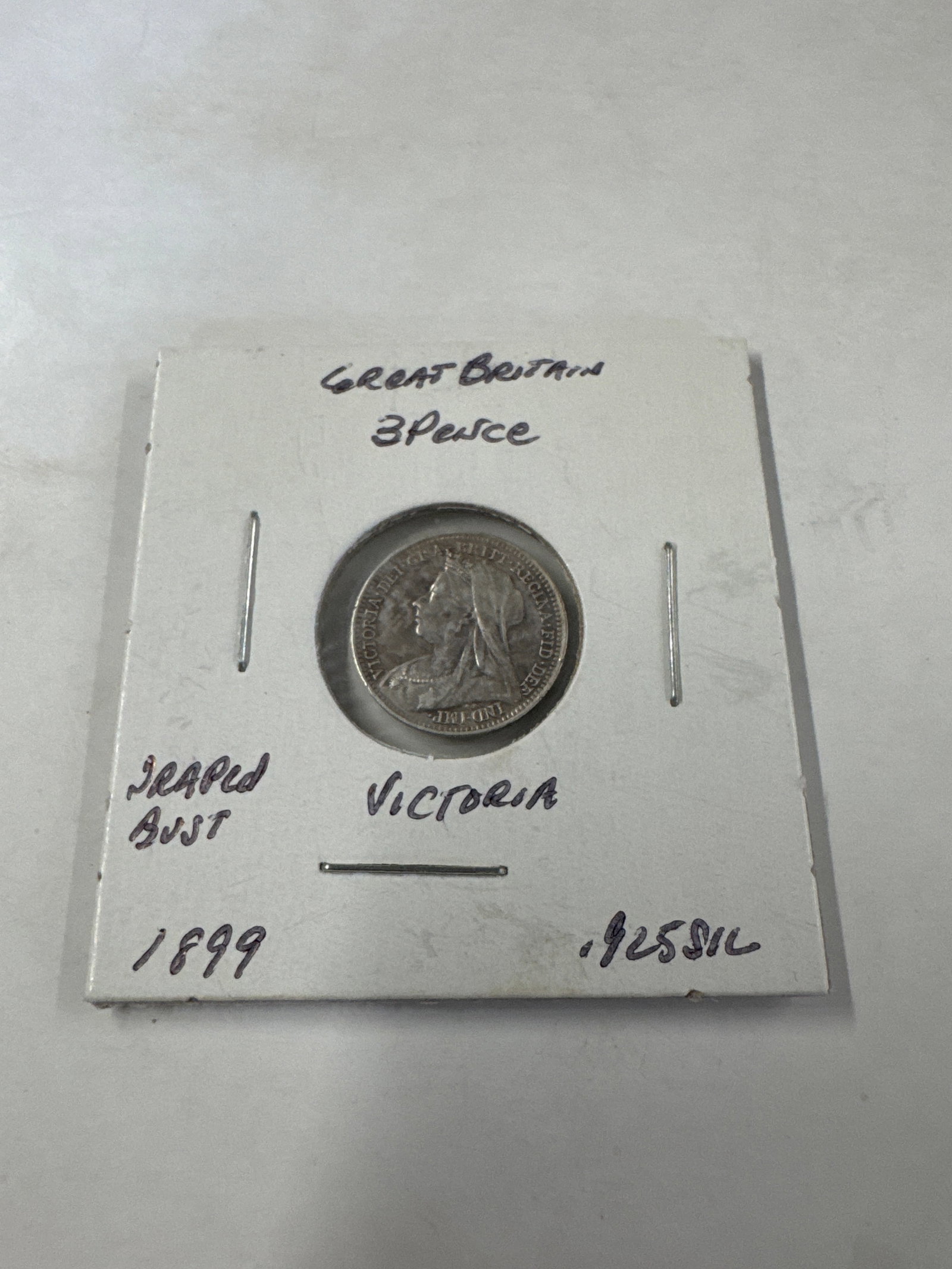 Great Britain 1899 3 Pence Silver Coin - Victoria: A silver 3 Pence coin from Great Britain, dated 1899. The coin features Queen Victoria and the denomination '3 Pence' on the reverse. 