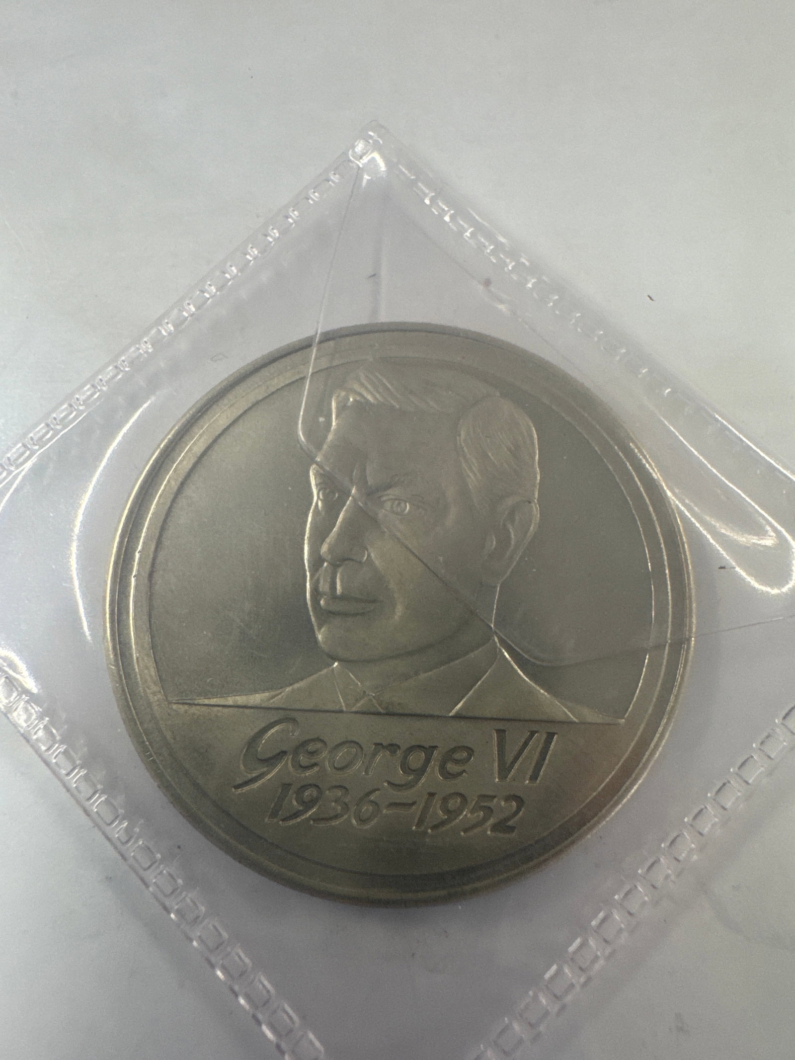 Commemorative Medal for George VI, 60th Anniversary of The Three Kings: A commemorative medal featuring a profile portrait of King George VI on the obverse, with the inscription "George VI 1936-1952". The reverse commemorates the "60th Anniversary of The Th