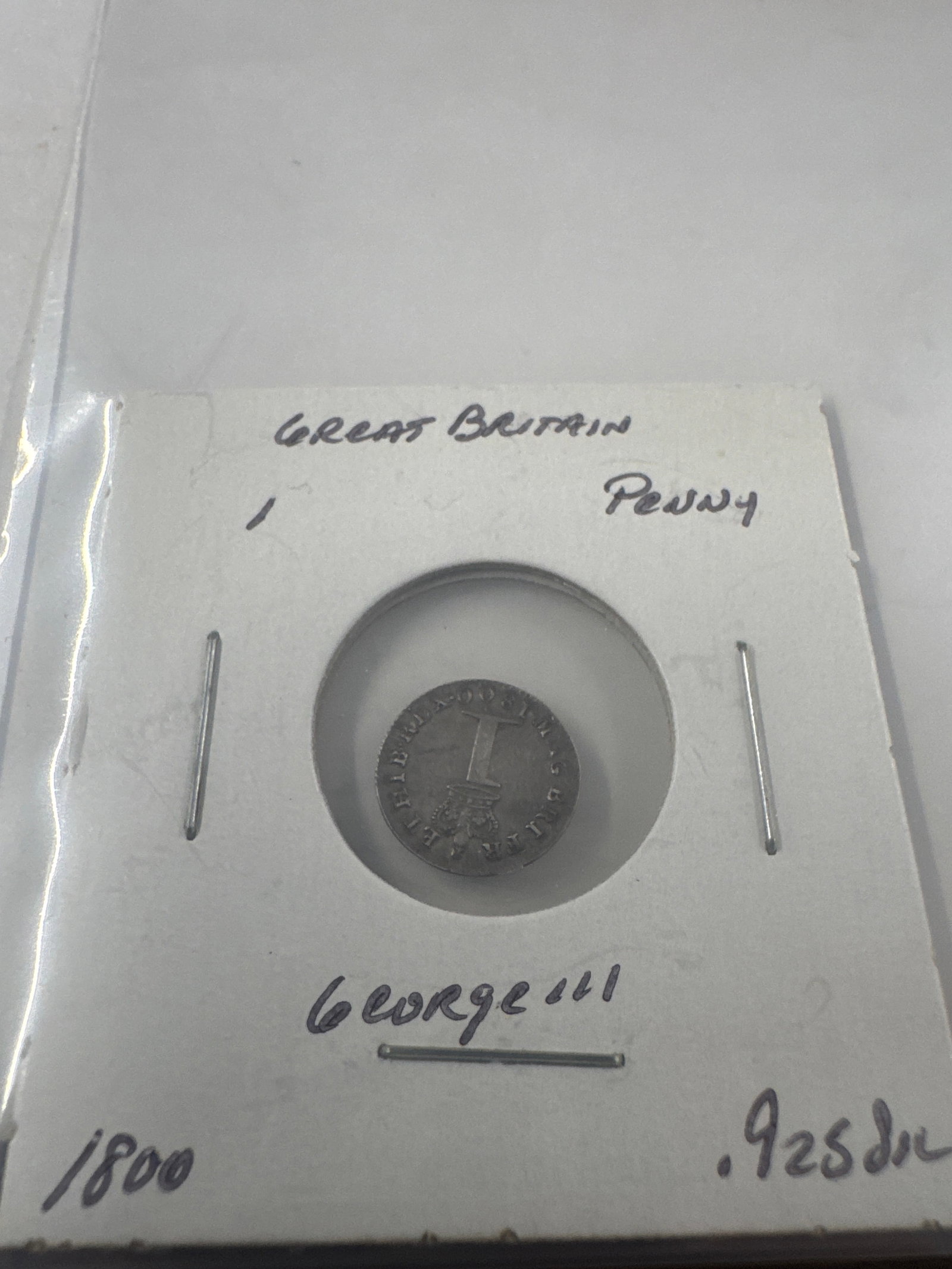 Great Britain 1800 George III Penny Coin: A silver penny coin from Great Britain, dated 1800, featuring a portrait of King George III. '.925 silver'.