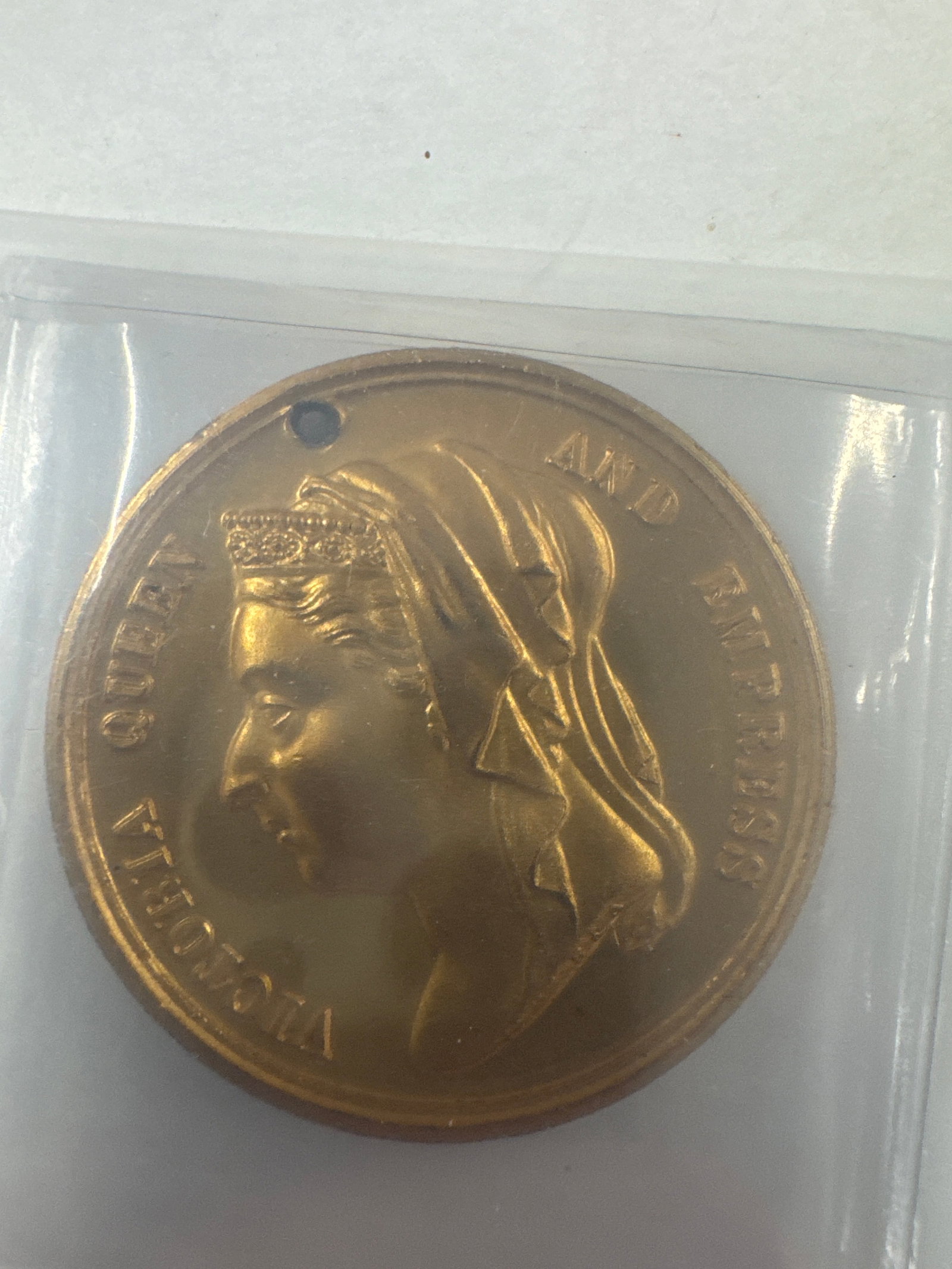 Victorian Era Commemorative Medal - Queen Victoria Jubilee 1887: A commemorative medal from the Victorian era, celebrating Queen Victoria's Jubilee in 1887. 