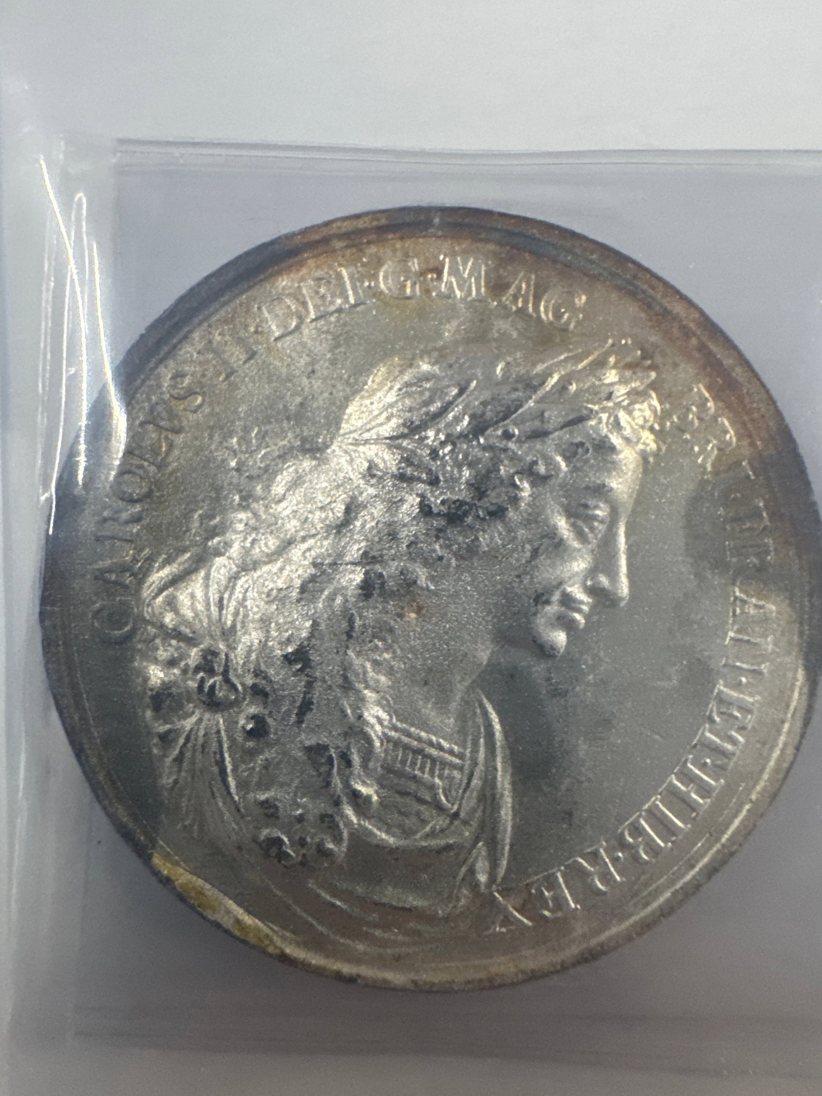 Silver Medal Featuring King Charles II and Queen Catherine of Braganza: A silver medal depicting profiles of King Charles II on one side and Queen Catherine of Braganza on the other. 