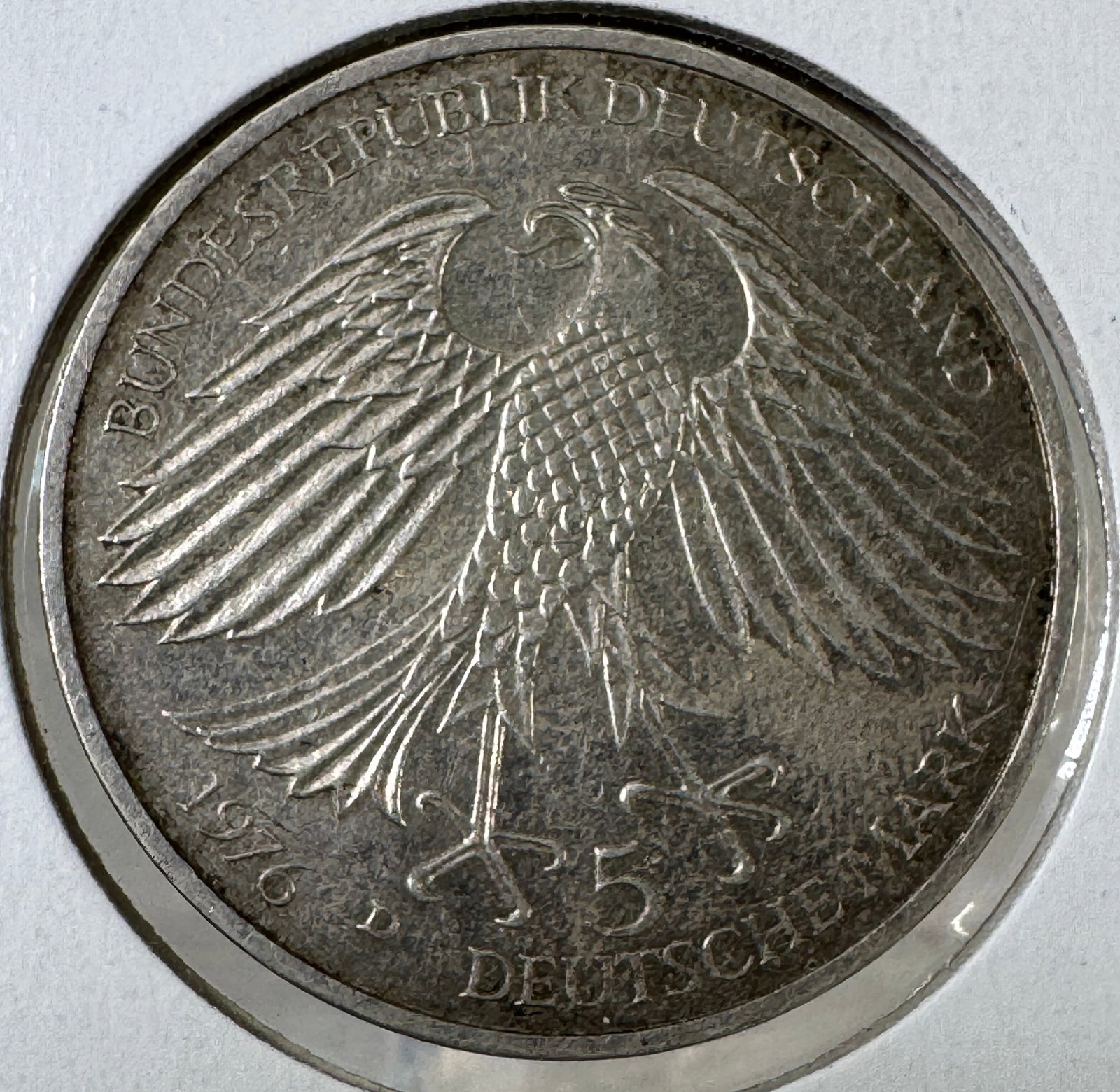 1621-1676 Federal Republic of Germany 5 Deutsche Mark Coin: 1621-1676 Federal Republic of Germany 5 Deutsche Mark coin commemorating Jacob von Grimmelshausen. Features the German eagle on one side and an image of Jacob von Grimmelshausen on the othe