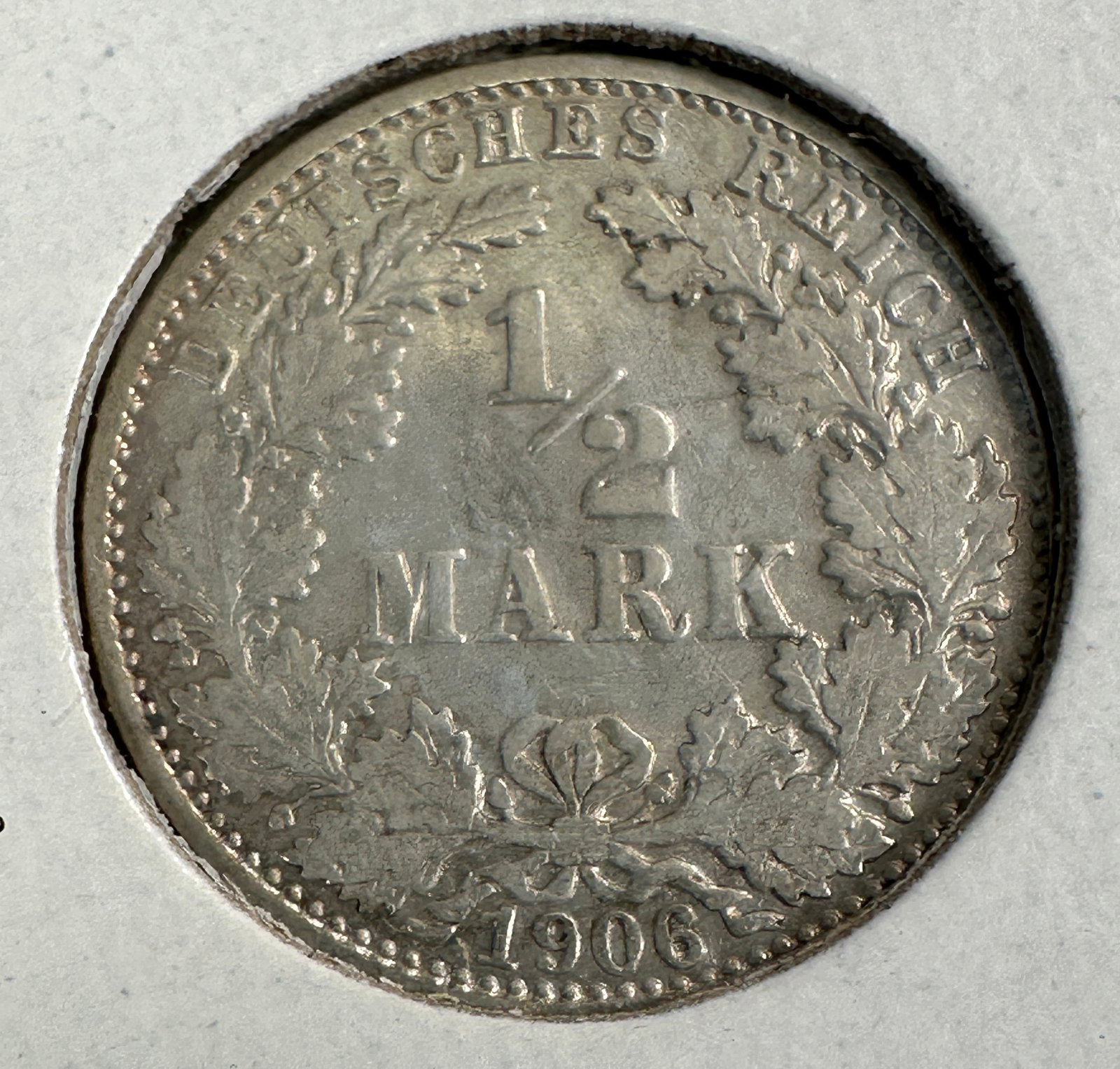 1906 German Empire 1/2 Mark .900 Silver Coin: One coin as titled. Ungraded; condition varies. See images.