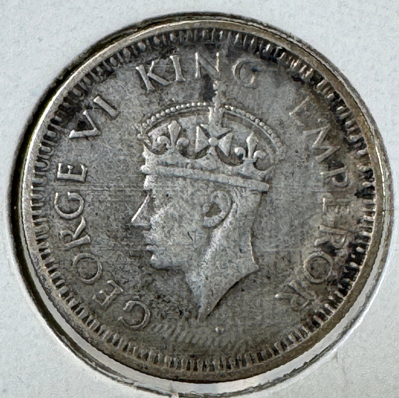 -*India - British 1/4 Rupee .500 Silver Coin, George VI, 1943: One coin as titled. Ungraded; condition varies. See images.