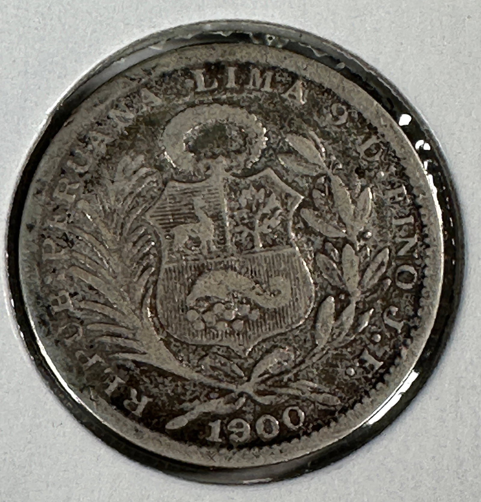 -*1900 Republica Peruana Lima 1/5 Sol .900 Silver Coin: One coin as titled. Ungraded; condition varies. See images.