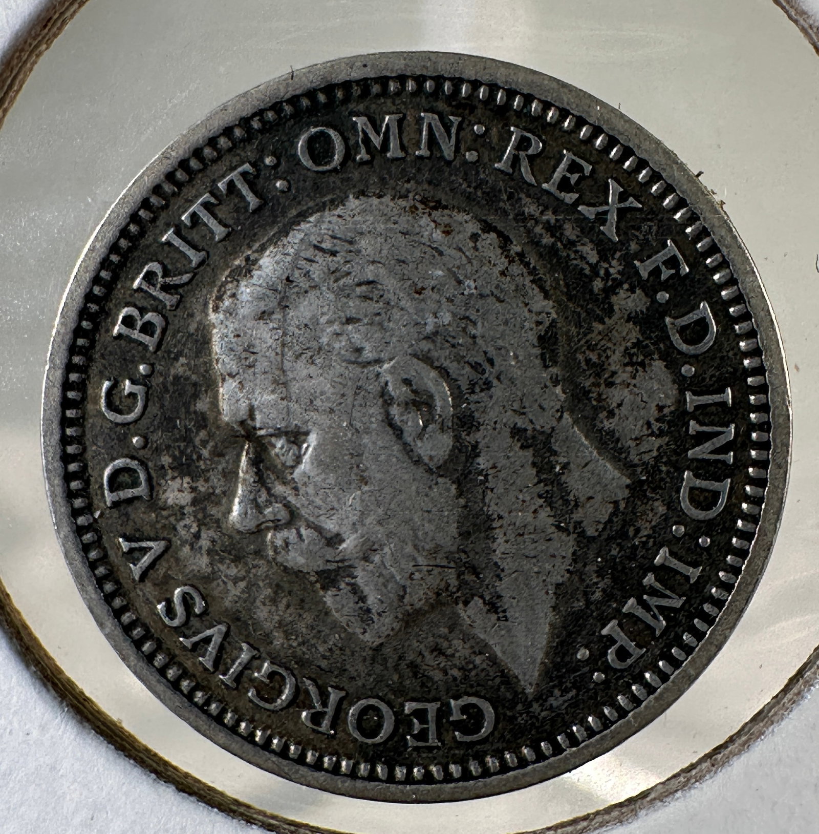 1934 Great Britain Three Pence .500 Silver Coin - George V: One coin as titled. Ungraded; condition varies. See images.