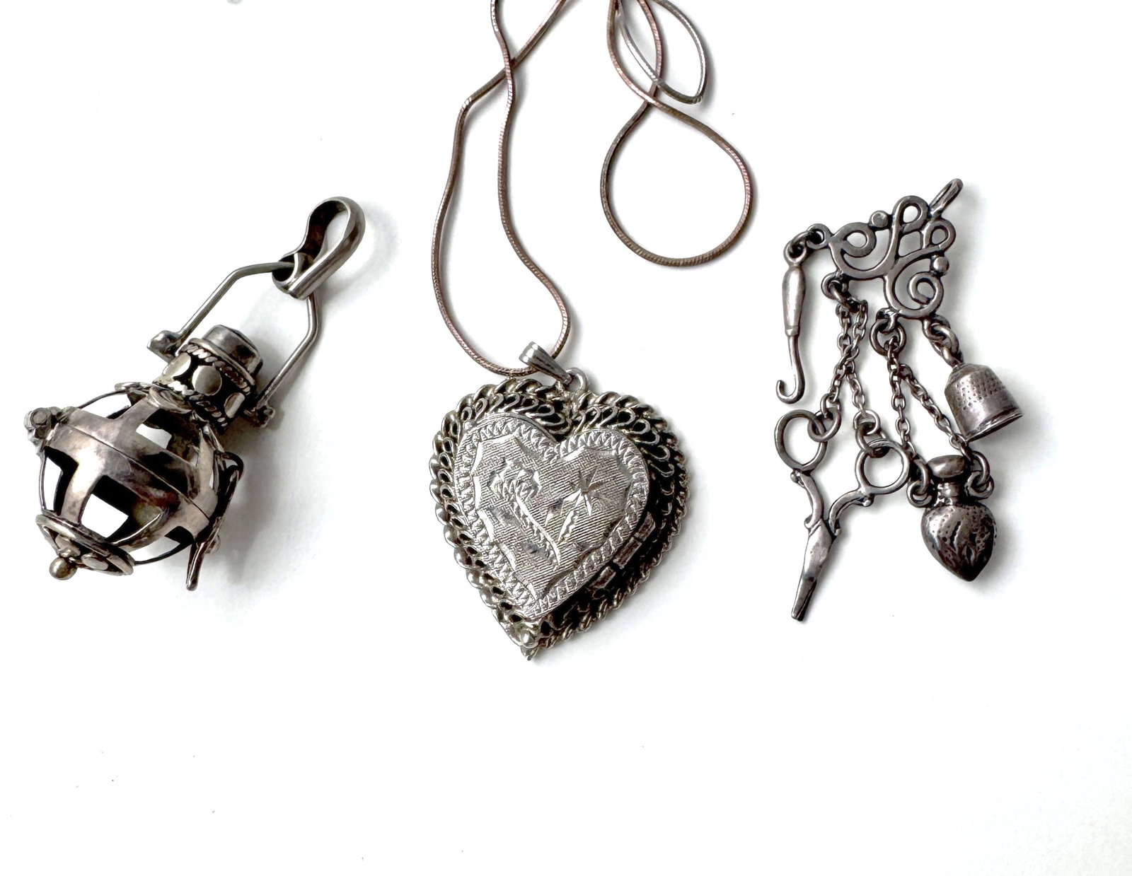 Three Sterling Silver Pendants/Charms: 22 grams, longest: 44mm