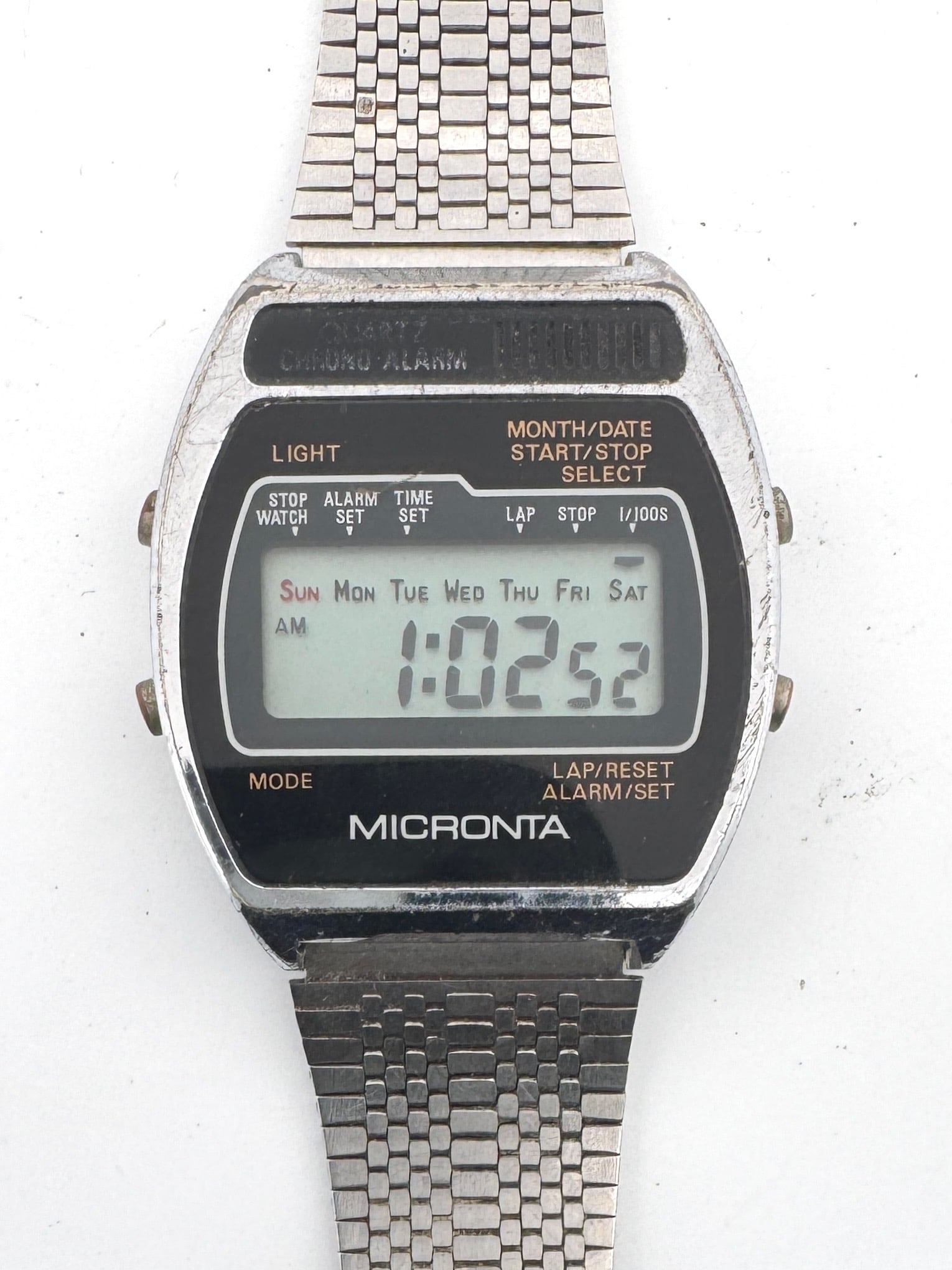 Micronta Quartz Chrono Alarm Digital Watch: Micronta Quartz Chrono Alarm digital watch with stainless steel band. Shows wear consistent with age. Untested. Weight: 1.9oz. Size: 1.5'' x 3.5''. 