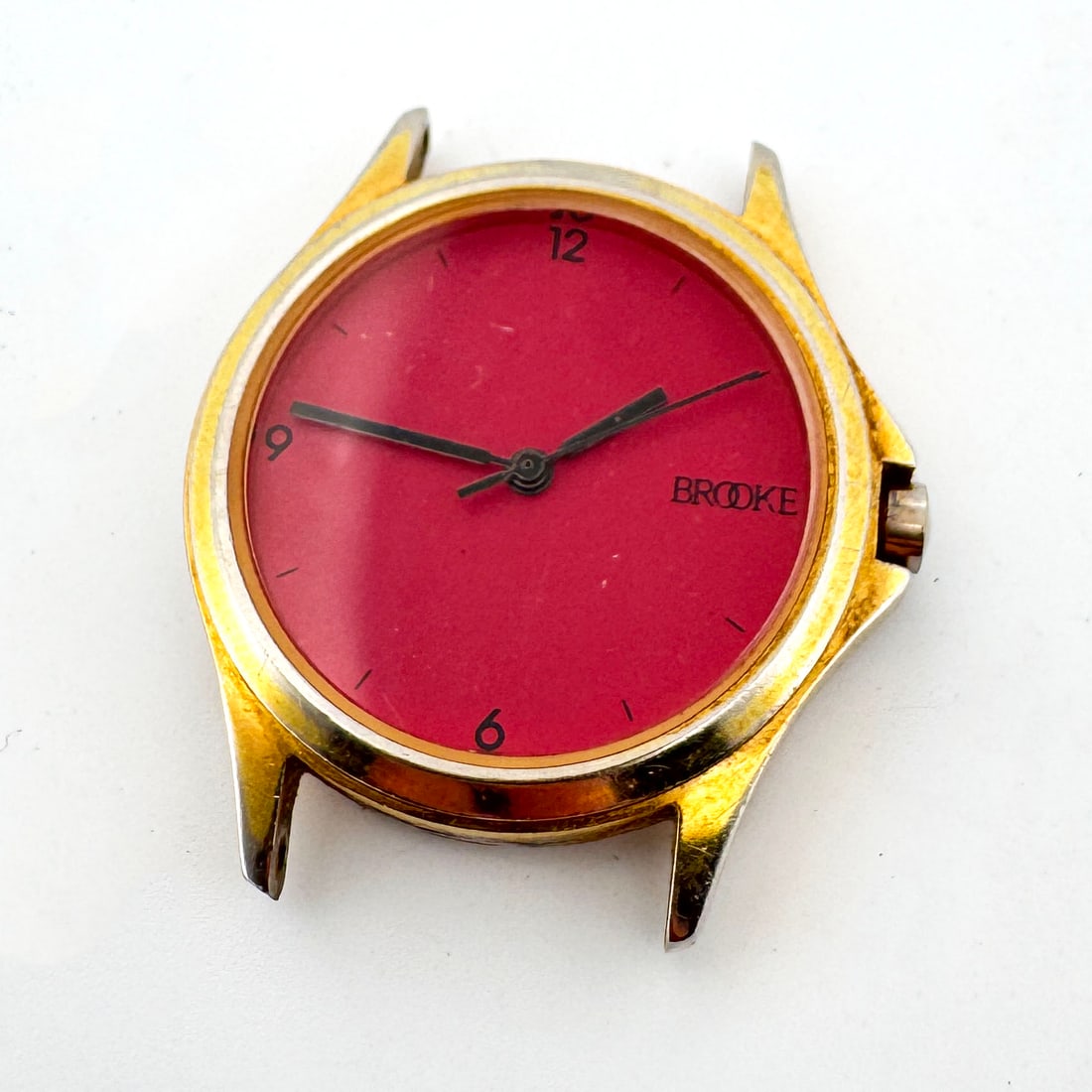Brooke Red Face Quartz Watch Head: This is a watch head featuring a vibrant red face with the 'BROOKE' logo. It has a stainless steel back and measures approximately 1.5 inches. The watch is marked 'WATER RESISTANT' and
