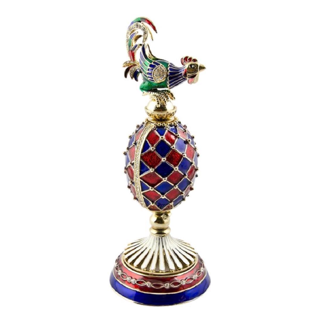 Faberge Inspired Rooster Egg Clock: Faberge-inspired Russian ornament, decorated with a green, blue & red enameled rooster, perched atop a red & blue harlequin pattern egg. Egg opens horizontally to reveal a removable golden quartz cloc