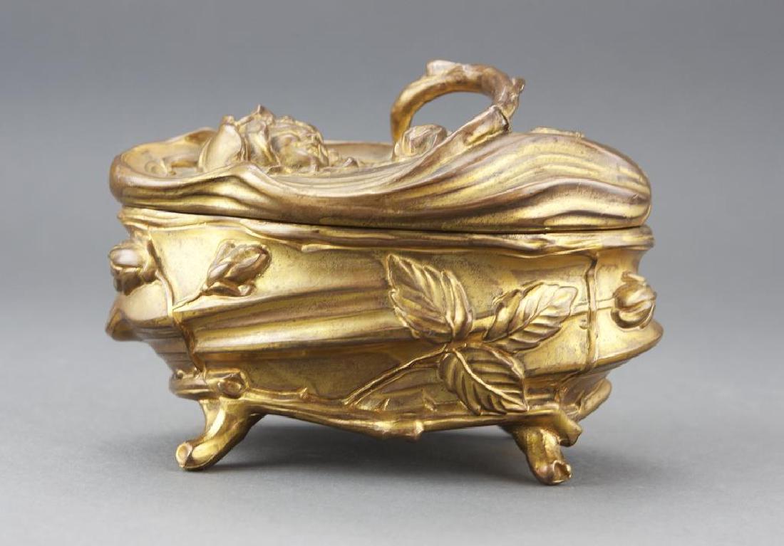 c1910 Art Nouveau N. B. Rogers Jewelry Casket: Lovely antique Nathaniel Burton Rogers Company gilded cast metal jewelry casket trinket box. Lidded & sitting on four raised feet. Dimensional body decorated with floral & foliate motifs. Features the