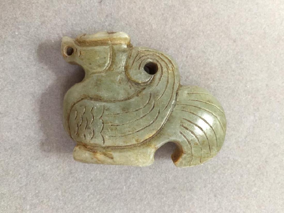 Carved Agate Stone Phoenix Totem: Chinese hand-carved agate, in the form of a standing phoenix bird. Can also be worn as a pendant. 1 3/4" X 2 1/4".