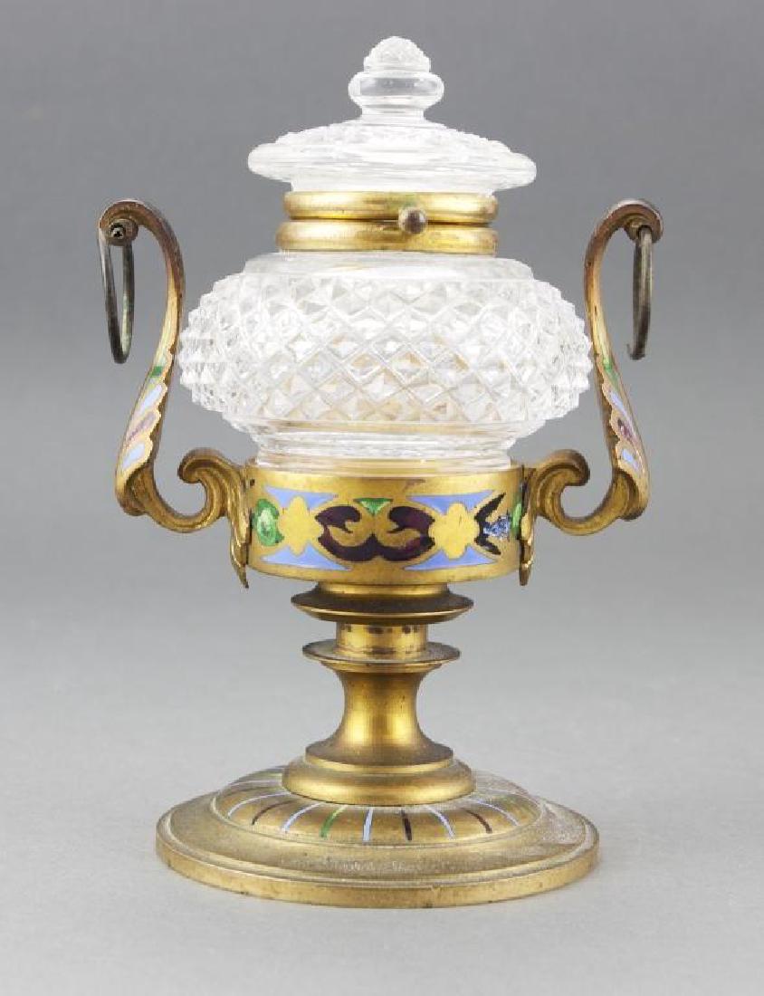 1880s Champleve Enamel Ormolu Cut Glass Inkwell: Antique 1880's champleve enamel ormolu cut glass inkwell. Pedestal & leaf scroll handled stand. Ormolu brass with champleve enamels on foot, collar, holders & handles. Mounted lid with diamond point p