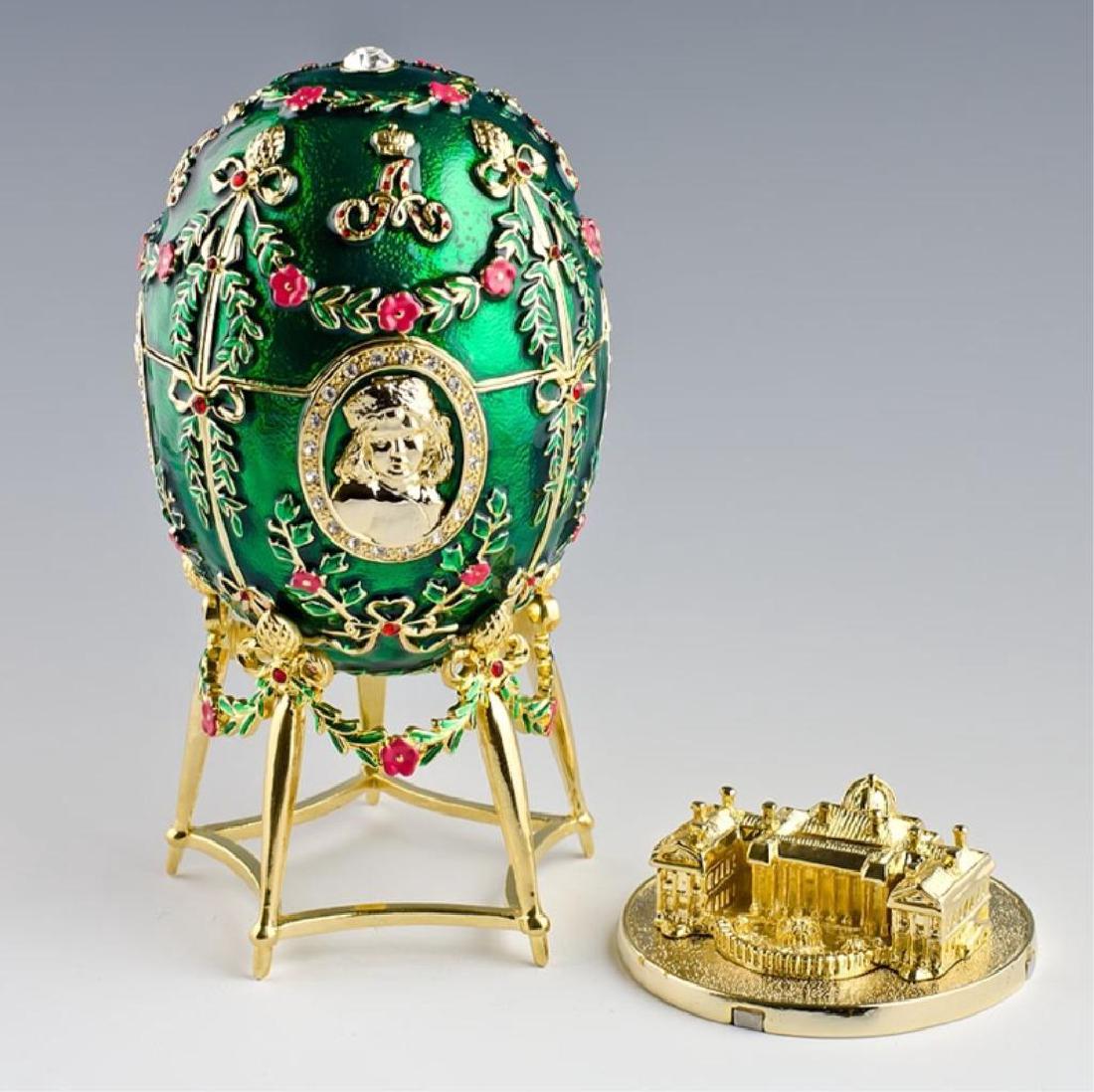 Alexander Palace Faberge Inspired Egg: The nephrite egg is adorned with five miniature portraits of the children of Tsar Nicholas II and Alexandra Fedorovna, and contains a replica of the Alexander Palace at Tsarskoe Selo. The oval portrai