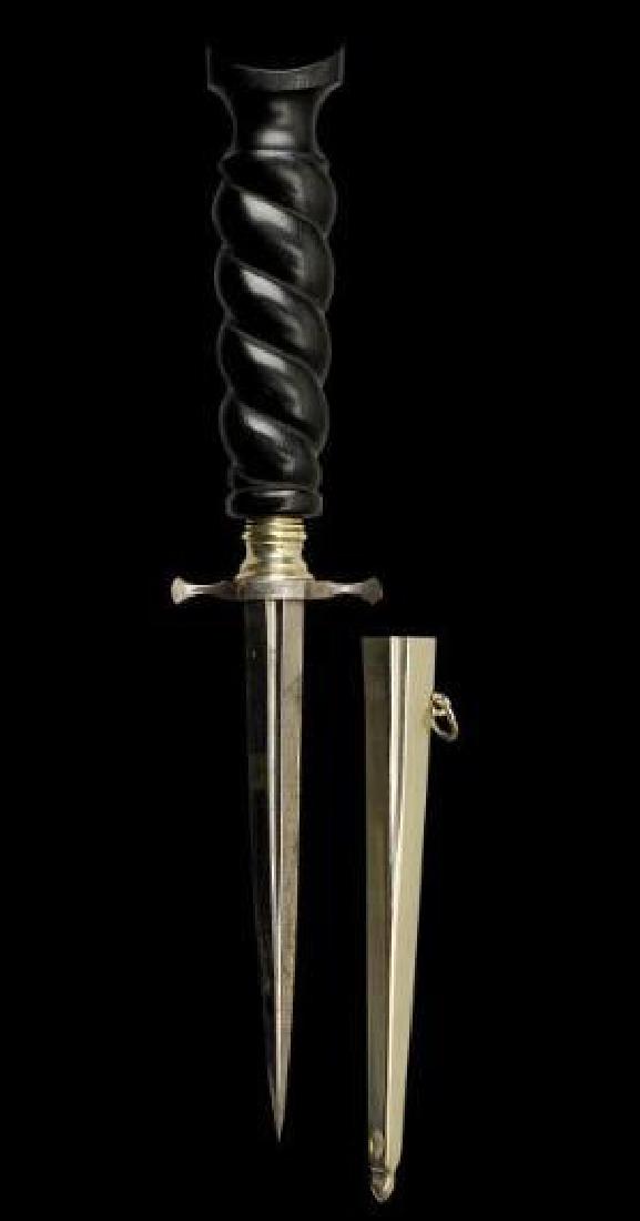 19thc Museum Quality Armor Piercing Dagger: 19th century Continental armor piercing dagger. Sturdy blade with a rhomboid cross-section, steel guard & belt hook. Ornate carved ebony handle. Complete with scabbard. In excellent condition. 9" L.