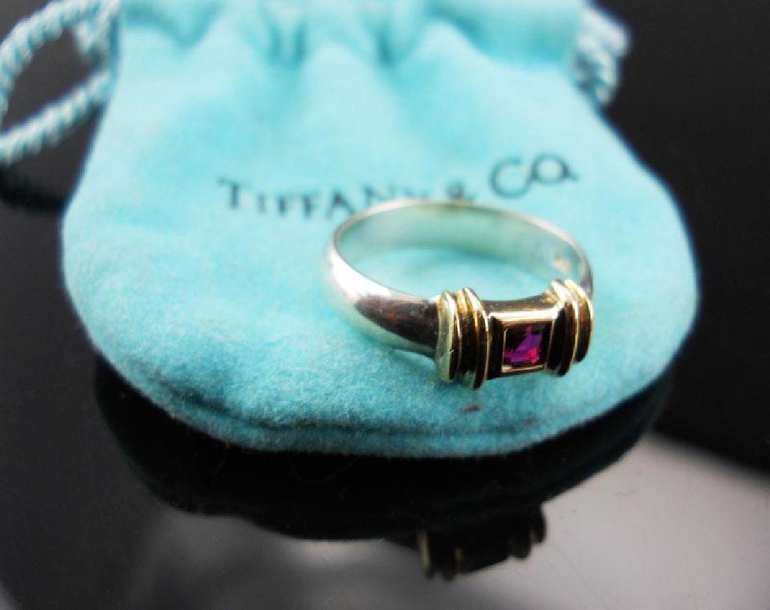 Tiffany & Co. 14kt & Sterling Ruby Ring: Tiffany & Co. 14kt yellow gold & sterling silver ruby ring. Stamped "Tiffany & Co 925" & 14K on inner band. Size 4. * comes with original Tiffany & Co blue pouch.