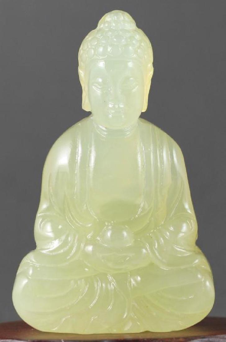Jade Buddha, Statue Totem Pendant: Chinese hand-carved, light green jade statue, totem of a seated Buddha. Tiny hole drilled for hanging as a pendant. 2 1/2" H X 1 1/2" W X 5/8" thick.