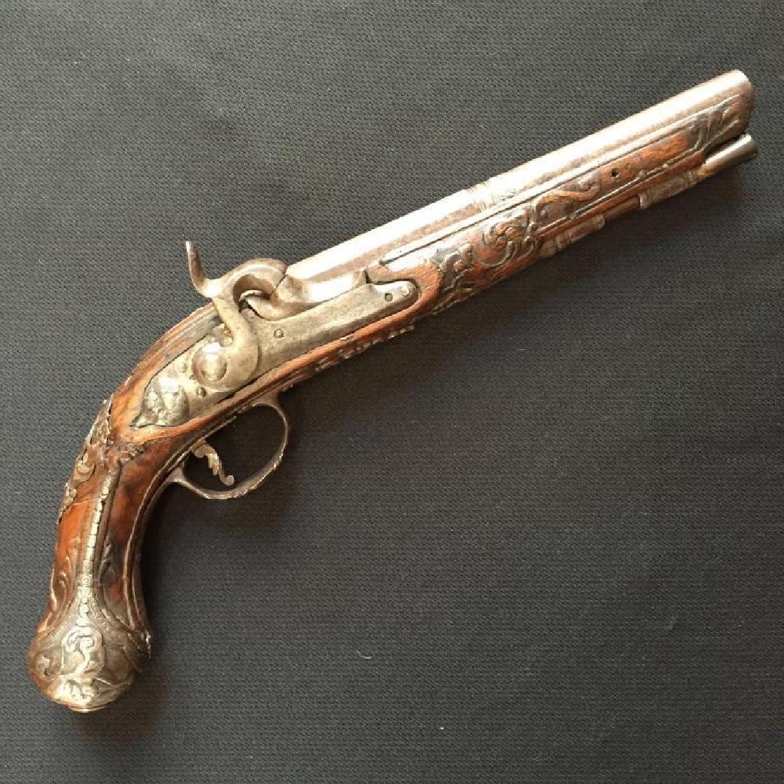 Late 17th - Early 18thc Italian Boarding Pistol: Late 17th to early 18th Century Italian naval officer's boarding pistol. Half hexagon, half round, smooth bore conversion to percussion walnut stock, heavily carved throughout. High relief engraved, t
