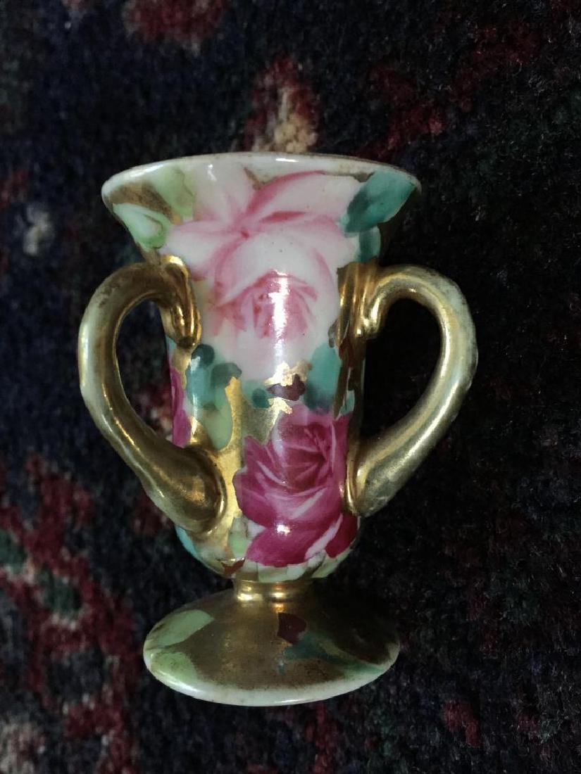 Nippon Roses & Gold Toothpick Holder: Hand-painted Nippon roses & gold china three handled urn toothpick holder. 2"W X 2 1/2" H. * in very good condition with only light wear to the gold on the handles. Stamped "Hand Painted & Nippon" on