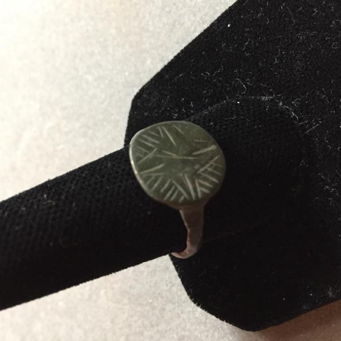 5th - 11thc AD Byzantine Bronze Crusader Ring: 5th - 11 Century AD, Byzantine crusader or pilgrim's bronze ring. Round bezel, depicting a stylized cross on a radial ground, suggesting the light of God. Wearable size 10.