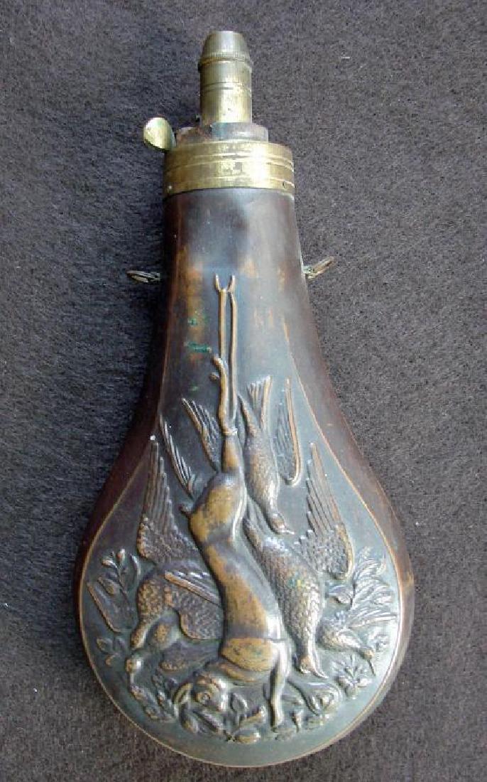 Mid 19thc Brass Game Hunting Powder Flask: Brass muzzle with heavily varnished, original brown lacquer over brass canister. Double swing swivels in tact. Spring in tact. Three dimensional embossed captured game - fowls, pheasants & rabbits. Ex