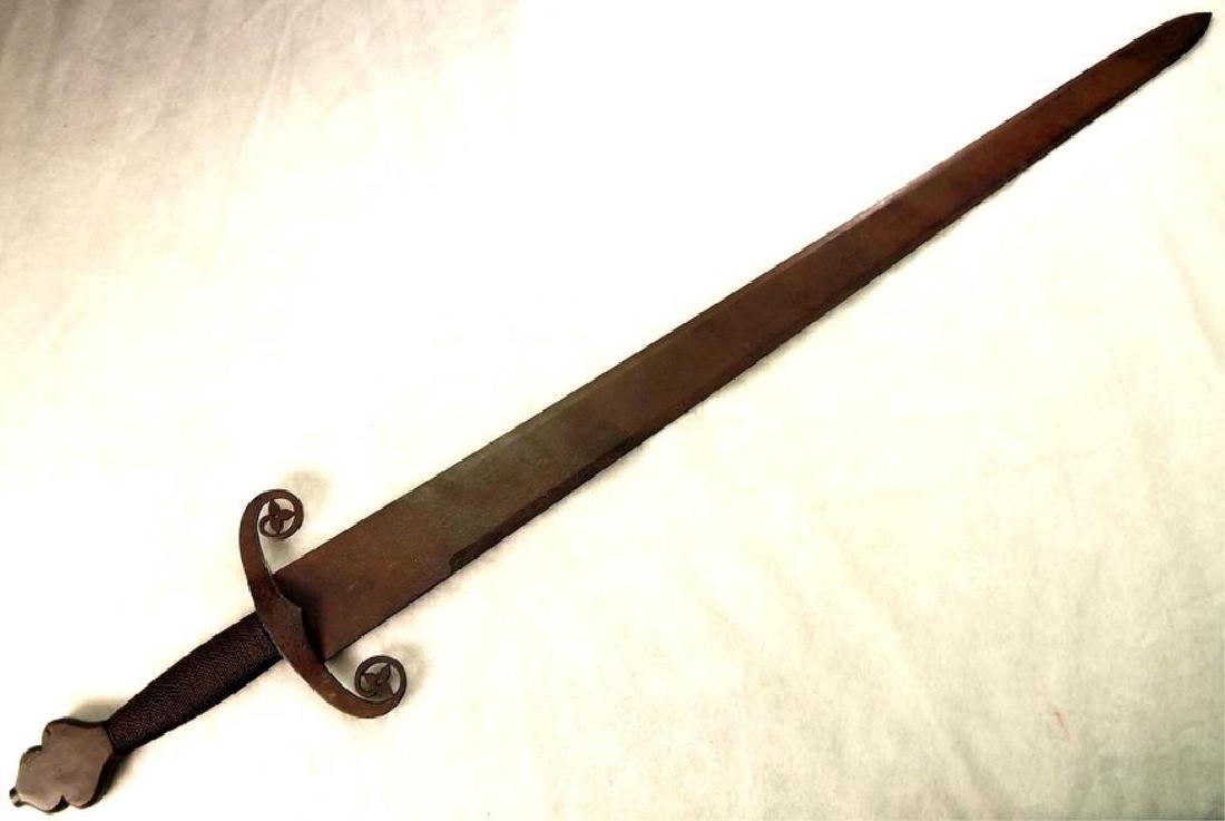 17thc Medieval Style Knight's Broad Sword: 17th century Continental Medieval-style knight's broad sword. Double edged blade, curved guard with ivy inserts. Twisted iron grip, with crown pommel cap. Dark brown patina overall. Very light if any 