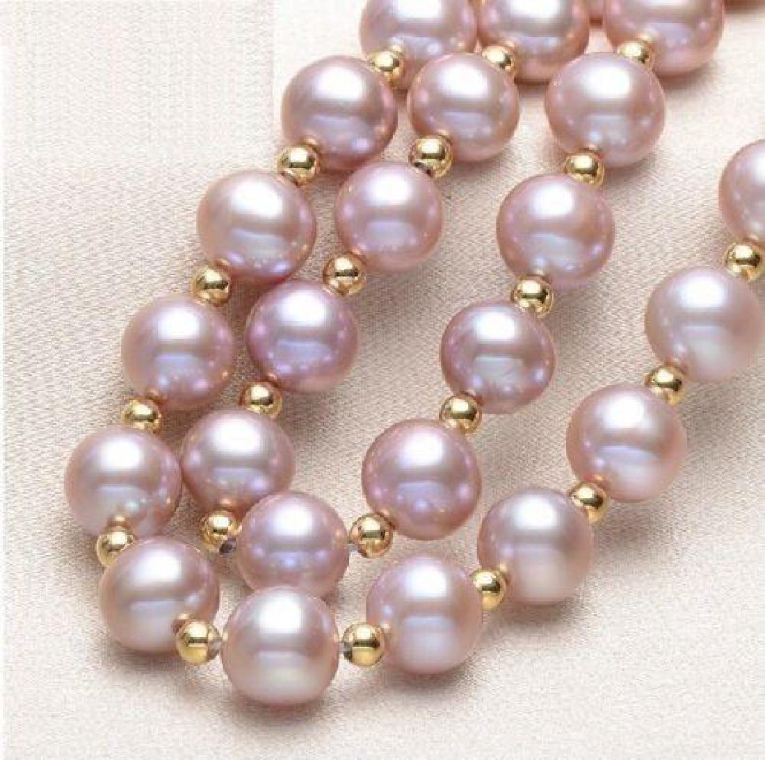 Natural Purple/ Pink South Sea Pearl 18" Necklace with: Natural South Sea pearl necklace. Matching pearls are light purple / pink in color, with 14k gold clasp. 18" length with intermediate spacers.