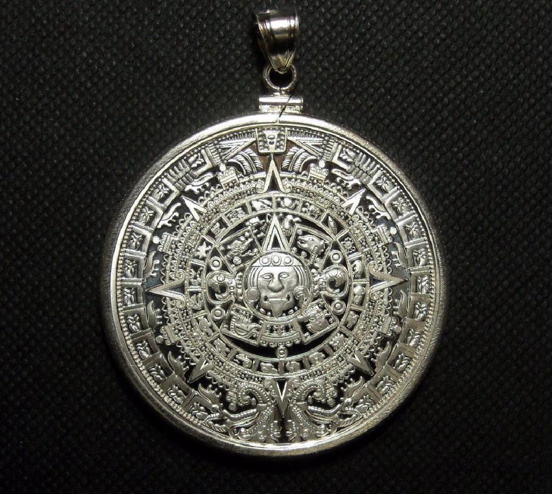 Aztec Mayan Calendar Medallion Pendant Solid Sterling: 1.6" Aztec Mayan Calendar Medallion Pendant Solid Sterling 925 Silver Coin Bezel Beautiful detail with proof mirror reflective background and frosted graphics.Comes with a hard plastic air tight capsu