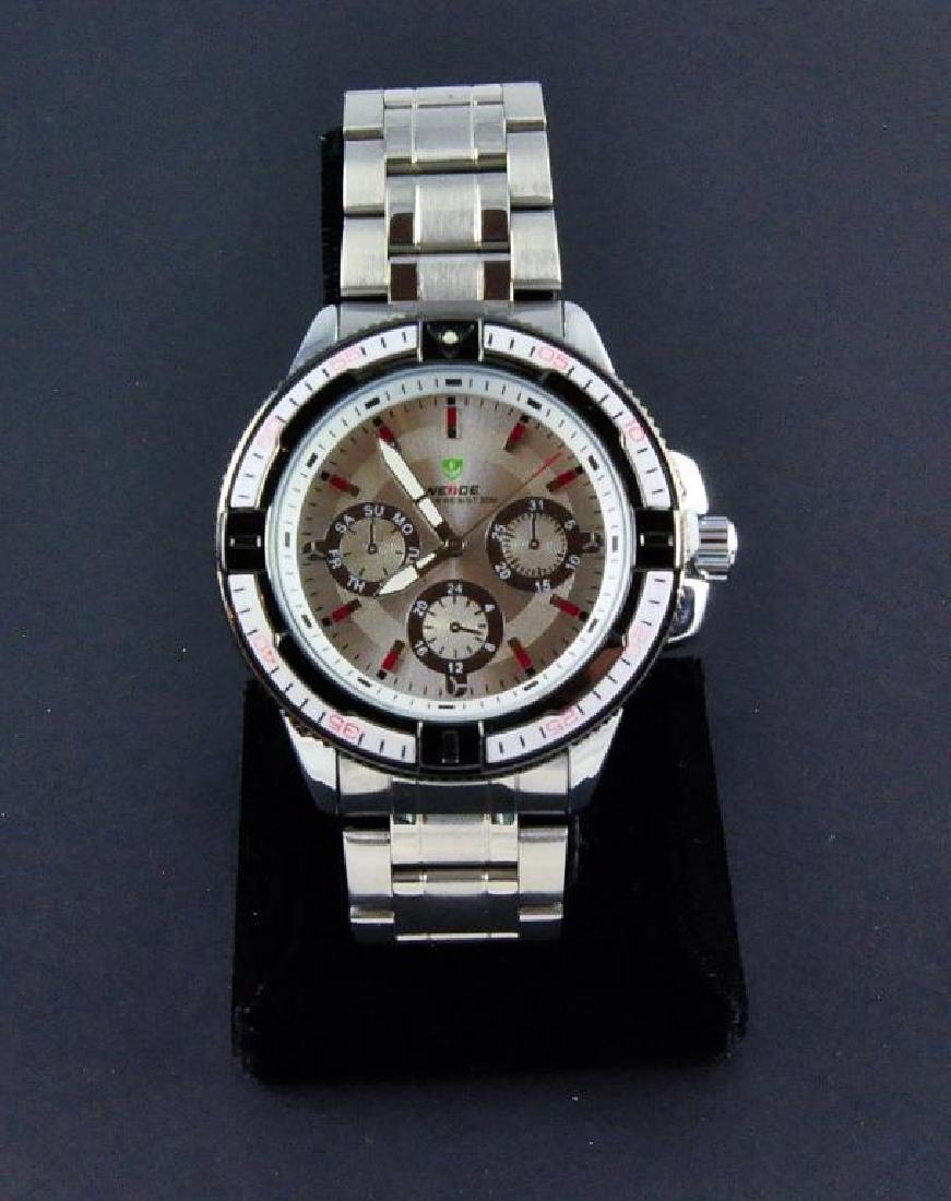Men's Stainless Steel Sports Wristwatch: Water resistant stainless steel. Quartz movement, three dial with military time & calendar display. Rolex-style linked stainless band. New store stock but needs replacement battery.