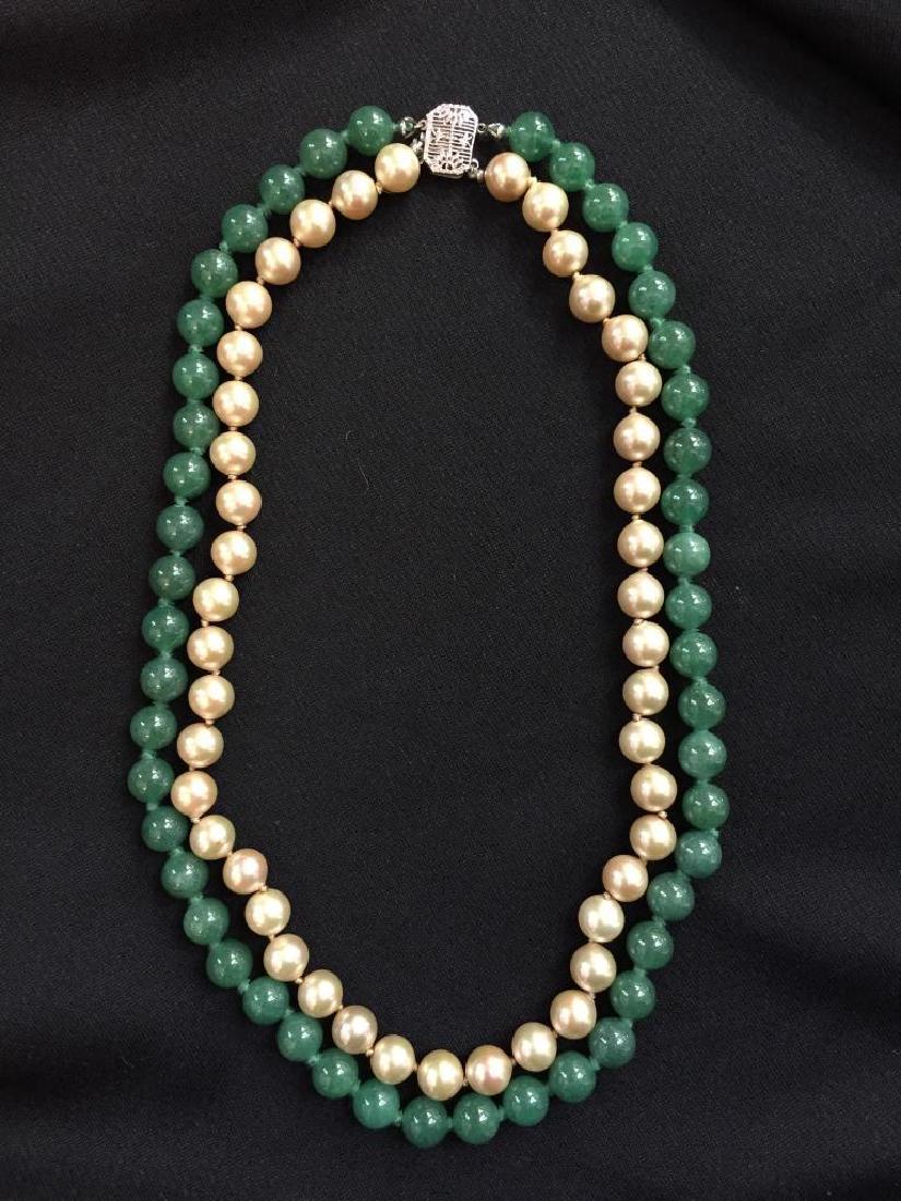 Vintage Double Row Jade & Pearl Necklace: Vintage double row emerald green jade & champagne shell pearl 16" necklace. Knotted necklace with 14kt white gold, delicate pattern clasp. Double row choker necklace with approx 8mm pearls & 8mm jade