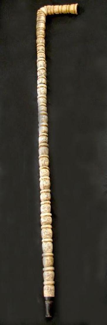 19thc Chinese Bone Ribbed Walking Stick Cane: 19thc Chinese ribbed bone walking stick cane, with 25 sections of etched Illustrations depicting village life. Two sections containing 4 character marks. Chinese coin embedded into the end of the 5"L 