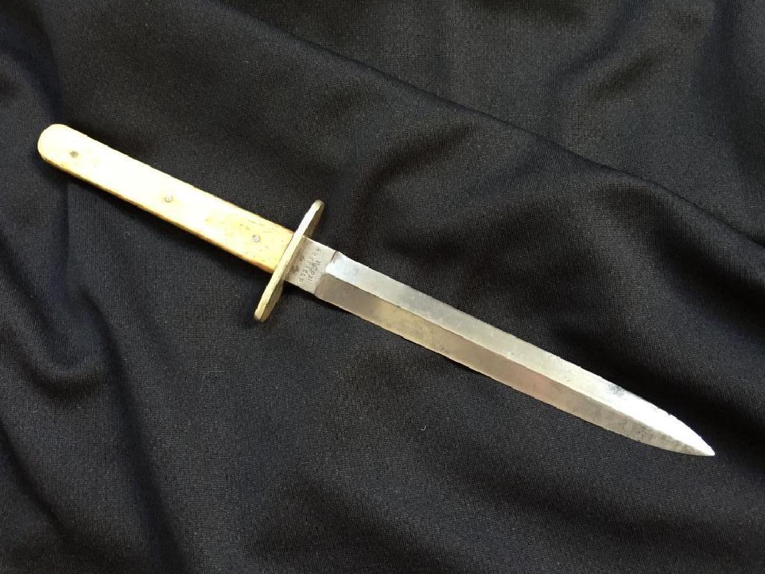 Early 1800's Sheffield Marked Dagger: Beautifully balanced double edged blade. German silver cross-guard. Polished bone grip, on one side showing early repair. Overall excellent to fine condition. 9 1/2" L. Blade 5 1/2" L.