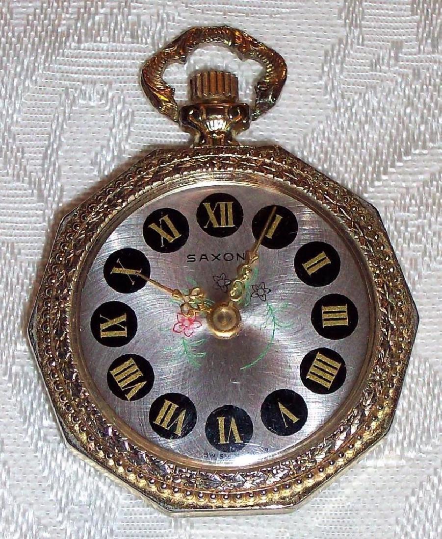 Vintage Estate Mother of Pearl Gold Pocket Watch: Vintage estate find, ladies gold ornate pocket watch with mother of pearl dial. Saxony brand with mechanical, self winding movement.Â Â