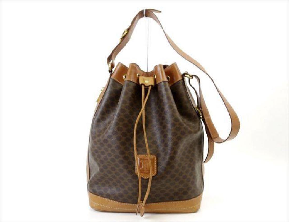 Vintage Celine Macadam Shoulder Bag: Vintage Celine shoulder bag, PVC leather made in Italy. Measures 9 1/2" X 13" X 6". Has a main compartment with a zippered pouch. Side zipper allows for front & back large hidden pockets. Celine P