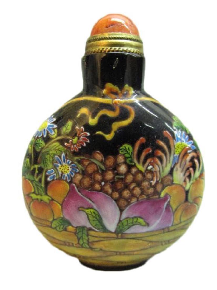 Chinese Hand-painted Enameled Snuff Bottle: Antique Chinese hand-painted enameled snuff or medicine bottle, depicting flowers & peaches with fingered citron pattern. Red stone top. Copper spoon in tact. Artist's signature on bottom. 2 1/2" H X