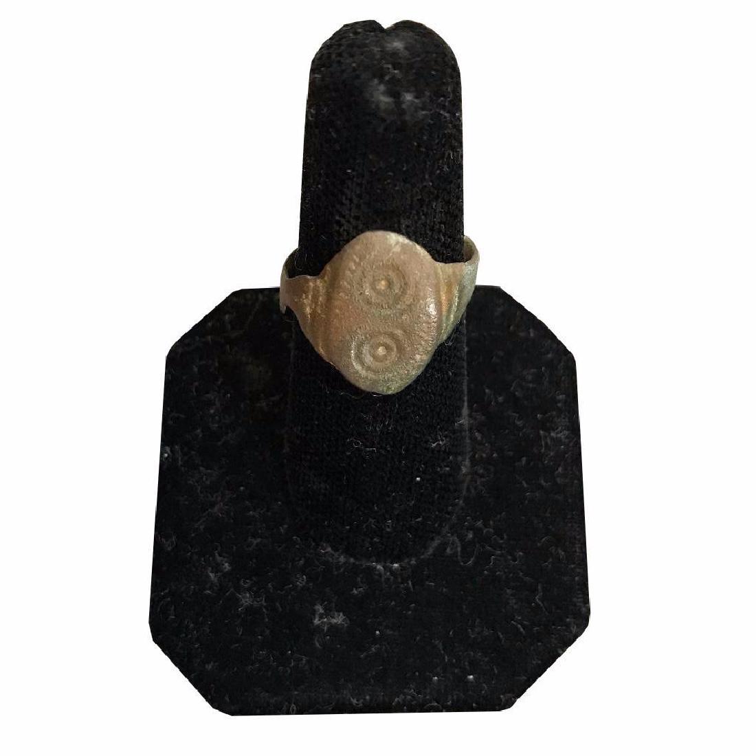 4th Century A.D. Ancient Roman Empire Evil Eye Bronze: c 350 A.D. Ancient Roman Empire ( Antiochia, Syria ) dug artifact bronze finger ring with concentric circles "Evil Eye" design on bezel. Misshapen & slight loss to area near bezel but wearabl