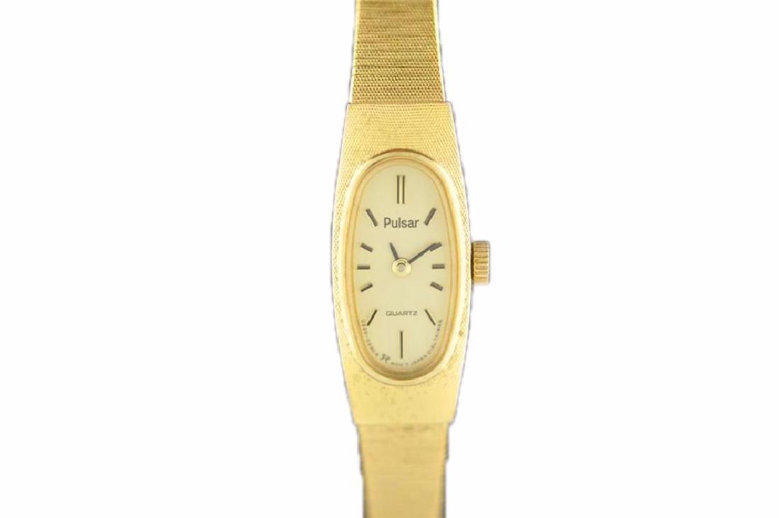 Vintage Ladies Gold Tone Pulsar Quartz Wrist Watch: Vintage ladies gold tone pulsar quartz wristwatch. Running movement with dial in good condition, hour/ minute hand intact. ?