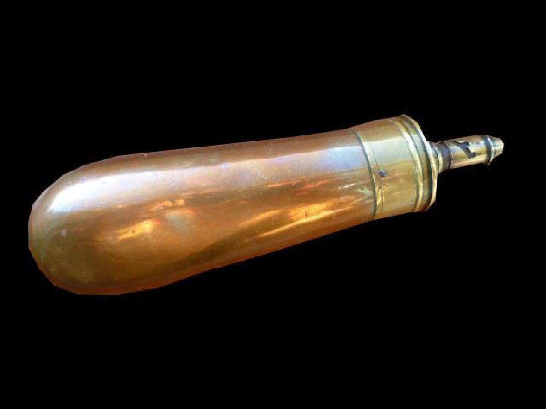 19thc James Barlow & Co Copper Powder Flask: Copper slim jim bag pistol flask with all solid brass fittings. Dented on one side, perfect on the other. Seams are tight. Top stamped "Improved Patent, James Barlow & Co Birmingham".