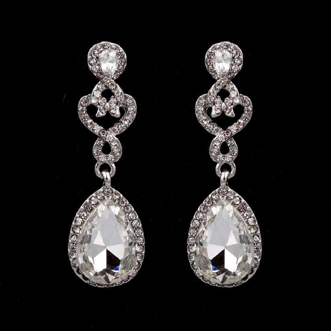 Rhodium Plated Clear Crystal Rhinestone Wedding Bridal: Rhodium Plated Clear Crystal Rhinestone Wedding Bridal Drop Dangle Earrings 0020 Stone / Color: Czech crystal / Clear Metal / Color: Rhodium plated / Rhodium Length: 2" Weight: One earring is 0.19 oz 