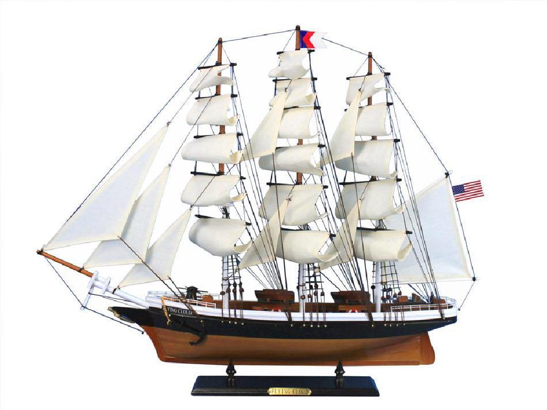 Wooden Flying Cloud Tall Model Clipper Ship 30": This fine tall ship model of the famous clipper ship Flying Cloud is perfectly sized for any shelf, desk, or mantle. Renowned for her speed and endurance sailing the open seas, these proud tall ship m