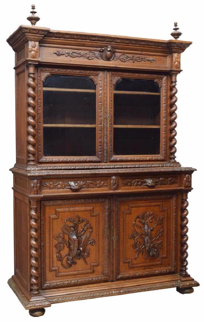 French Henri Ii Style Carved Oak Game Sideboard: French Henri II style oak sideboard with carved scens of the hunt, c. 1880, in the style popularized by Alexander Roux, having turned finials to top, acanthus molding accents throughout, cornice over