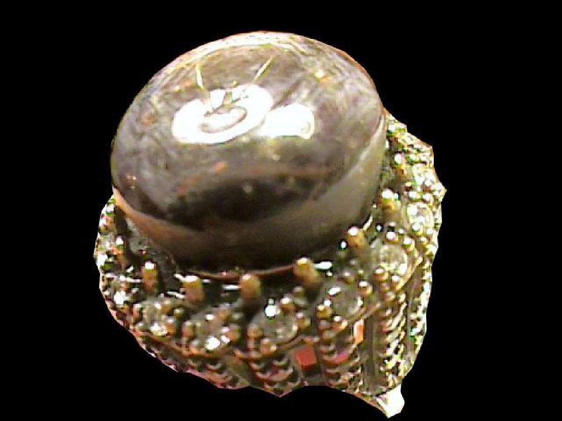 Bold Black Star Sapphire Cabochon Ring: Vintage & bold, Indian black gray star sapphire, complex color, semi rough, natural stone with a nice glow. Ruby, emerald & white sapphire accent stones set into sterling silver. Band stamped 925. Siz