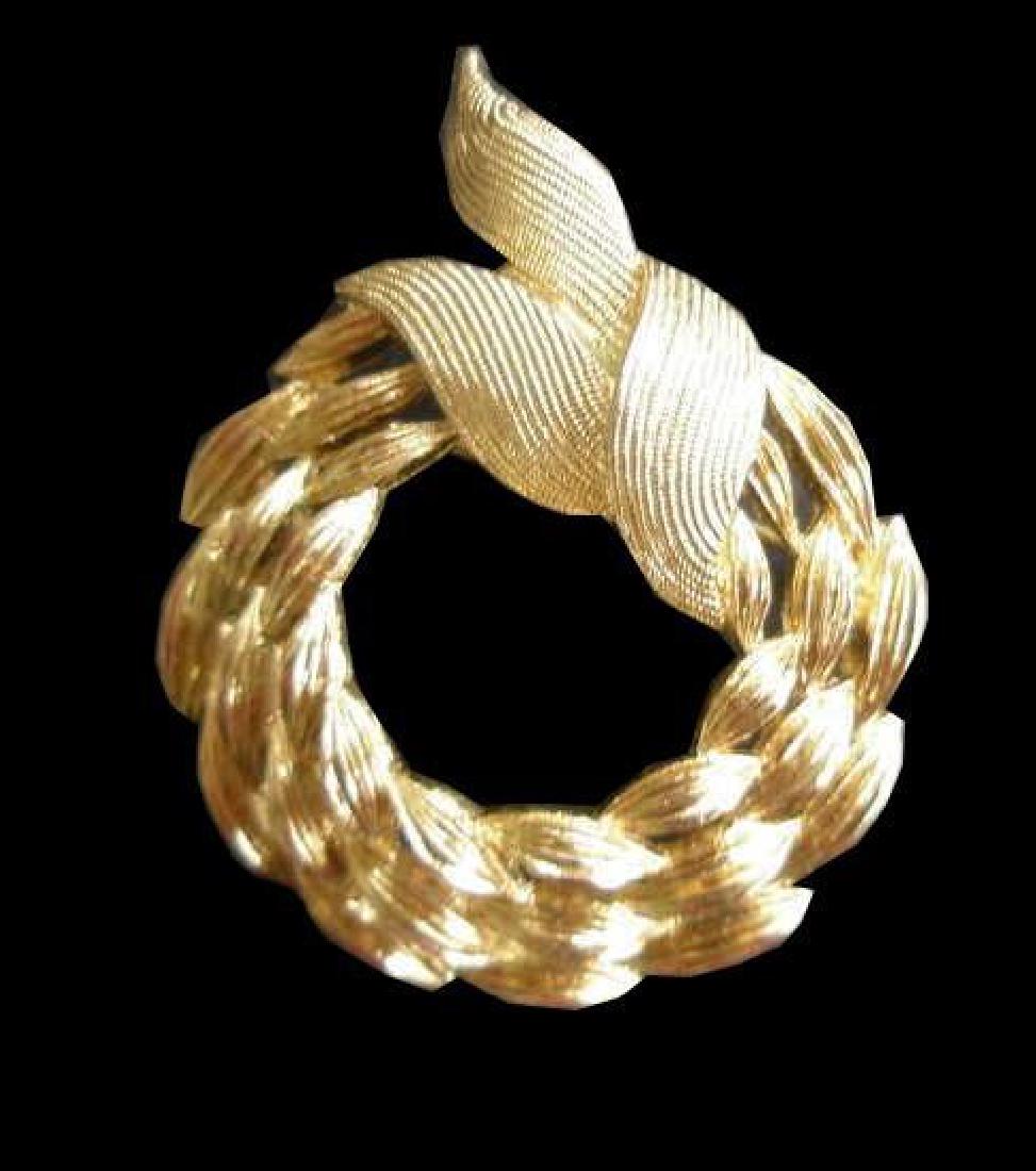 Vintage Gold Pin Brooch: Timeless gold-tone fashion jewelry piece. Marked on the reverse, “Monet”. 1 1/2” D. Founded in 1919, this company once produced pieces for Yves Saint Laurent & Christian Lacroix. Monet Costume P