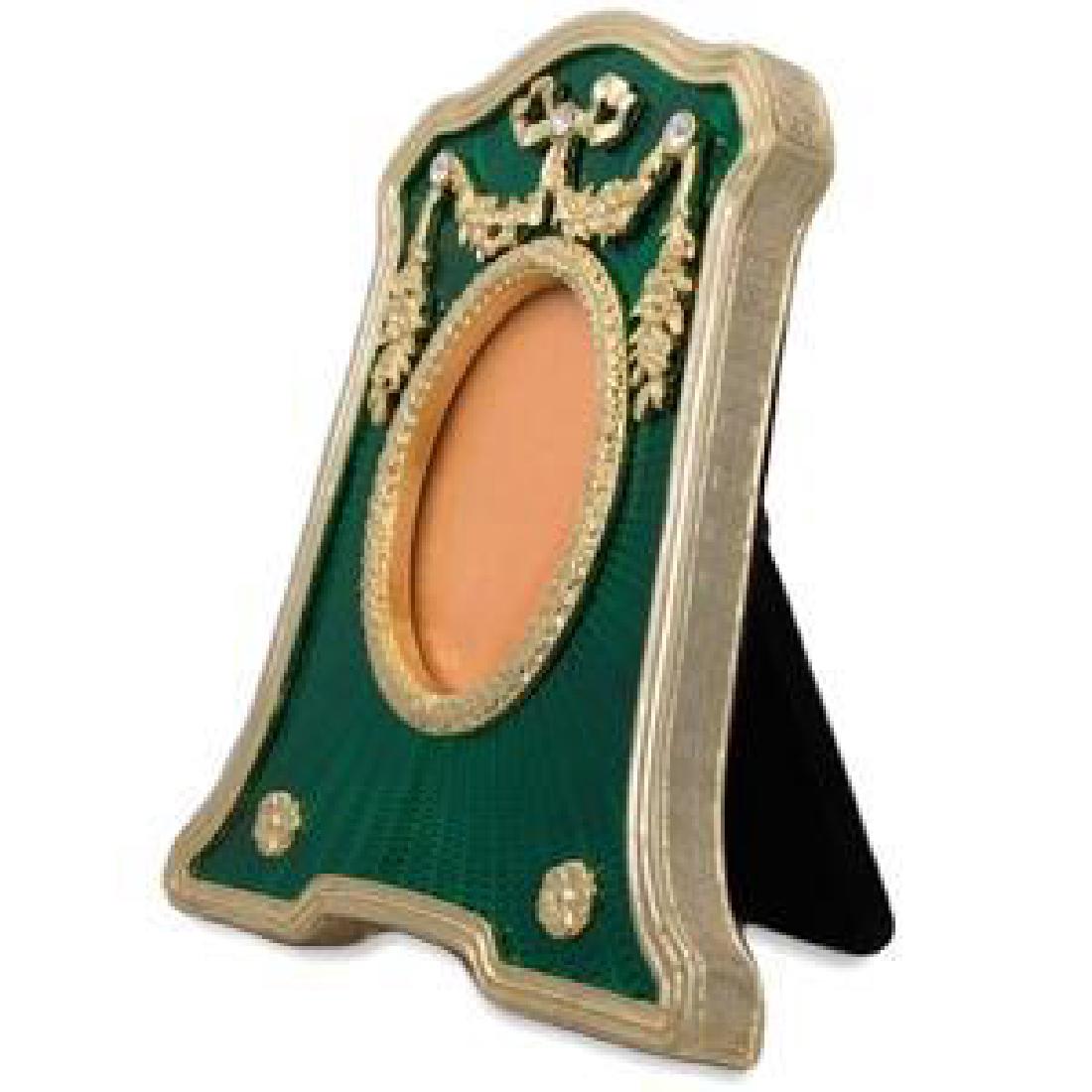 Faberge Rectangle with Oval Opening Green Enameled: 4.5'' Faberge Rectangle with Oval Opening Green Enameled Guilloche Russian Antique Style Picture Frame 4.5'' (H) x 3.75'' (L)Photo Opening Dimensions: 1.75" (H) 1.25" (W)Pewter, Enamel, Crystals Gift