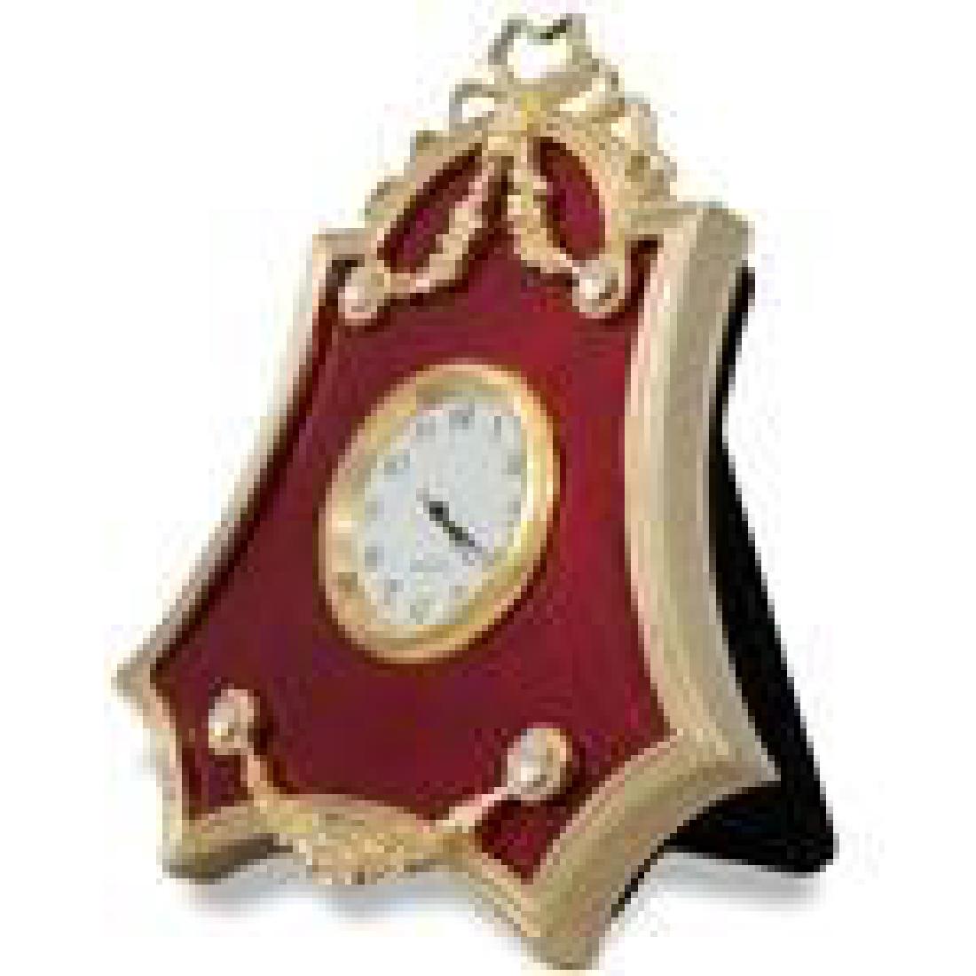 4" Faberge Red Enameled Guilloche Russian Antique Style: 4" Faberge Red Enameled Guilloche Russian Antique Style Clock The framed clock is in two color gold-mounted red enamel surrounded by a crystal set ribbon tie suspended by a laurel garland. The frame's