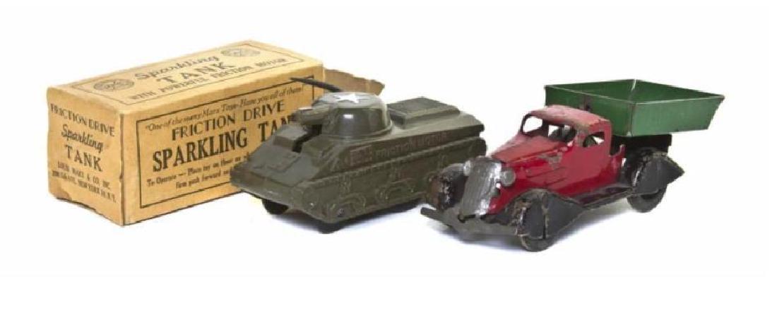 Pair of Mid 20th Century Marx Friction Drive Toys: Marx friction drive sparkling tank, together with a friction drive dump truck. Length of longer is 6". Tank comes with original box. Nice set for a vintage toy collection.