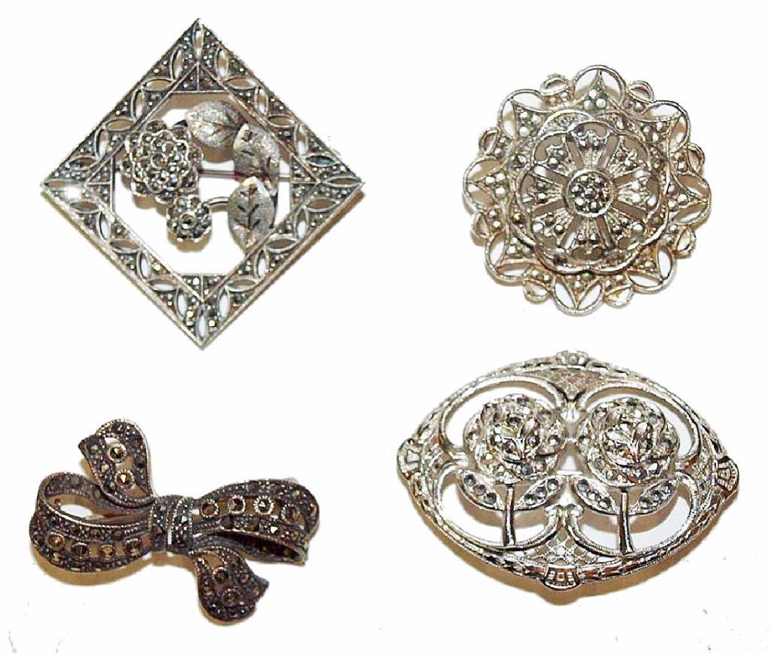 Grouping Of Circa 1920 Marcasite Brooches: Group of four Interesting sterling silver Marcasite broaches in excellent condition. The